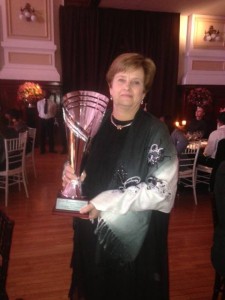 Lynda Smith and her award for BrainBoosters