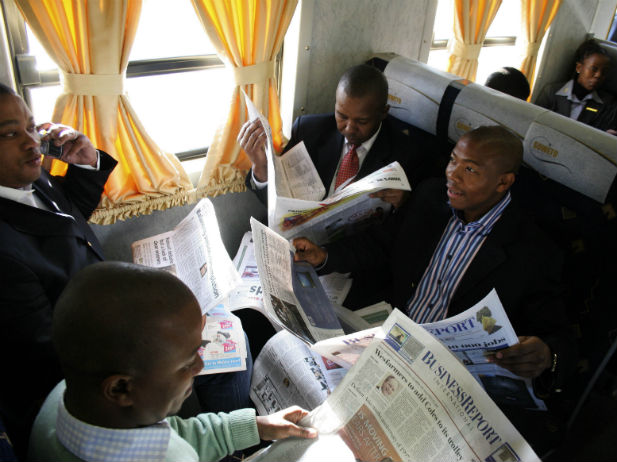 African businessmen on a train