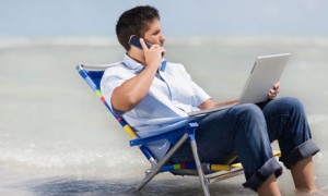 Man in beach chair working